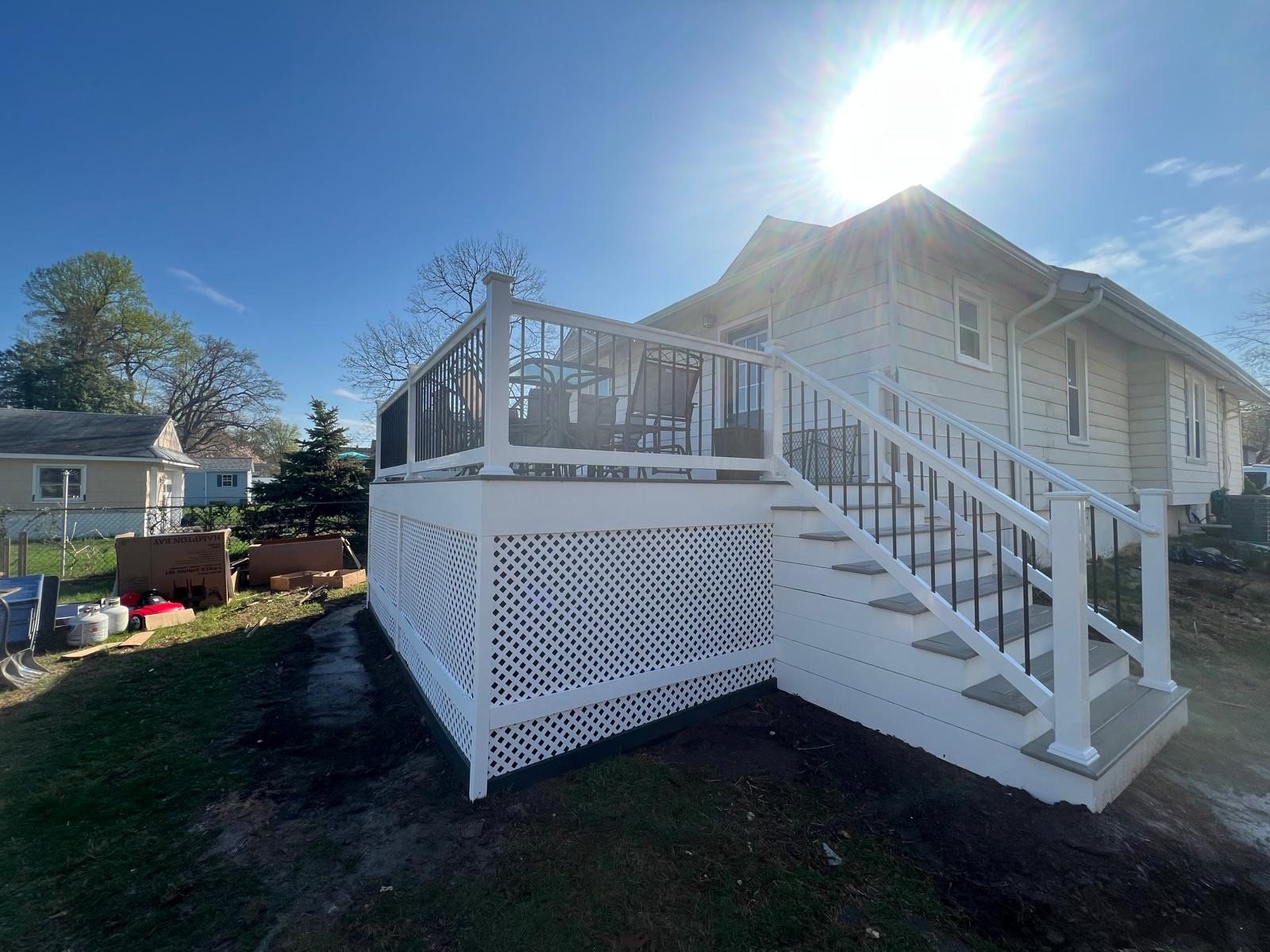 Elevated deck with staircase down to the backyard