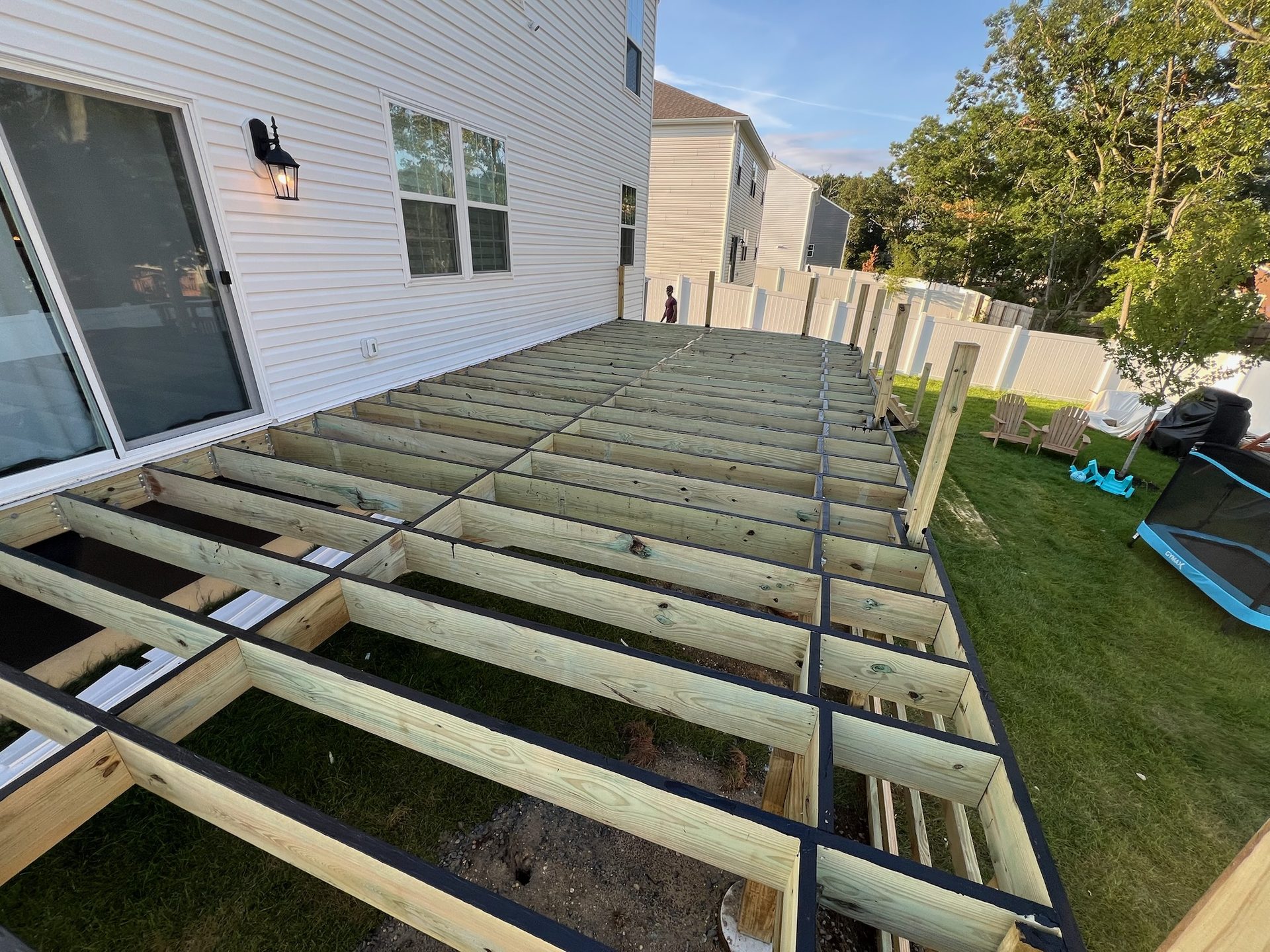 Deck joist framing under construction