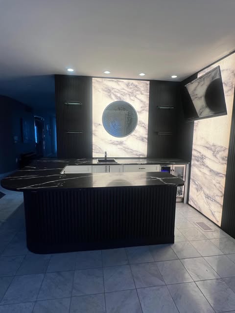 Custom kitchen and bar remodel with marble surfaces