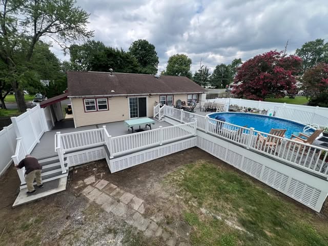 Composite deck built around a pool